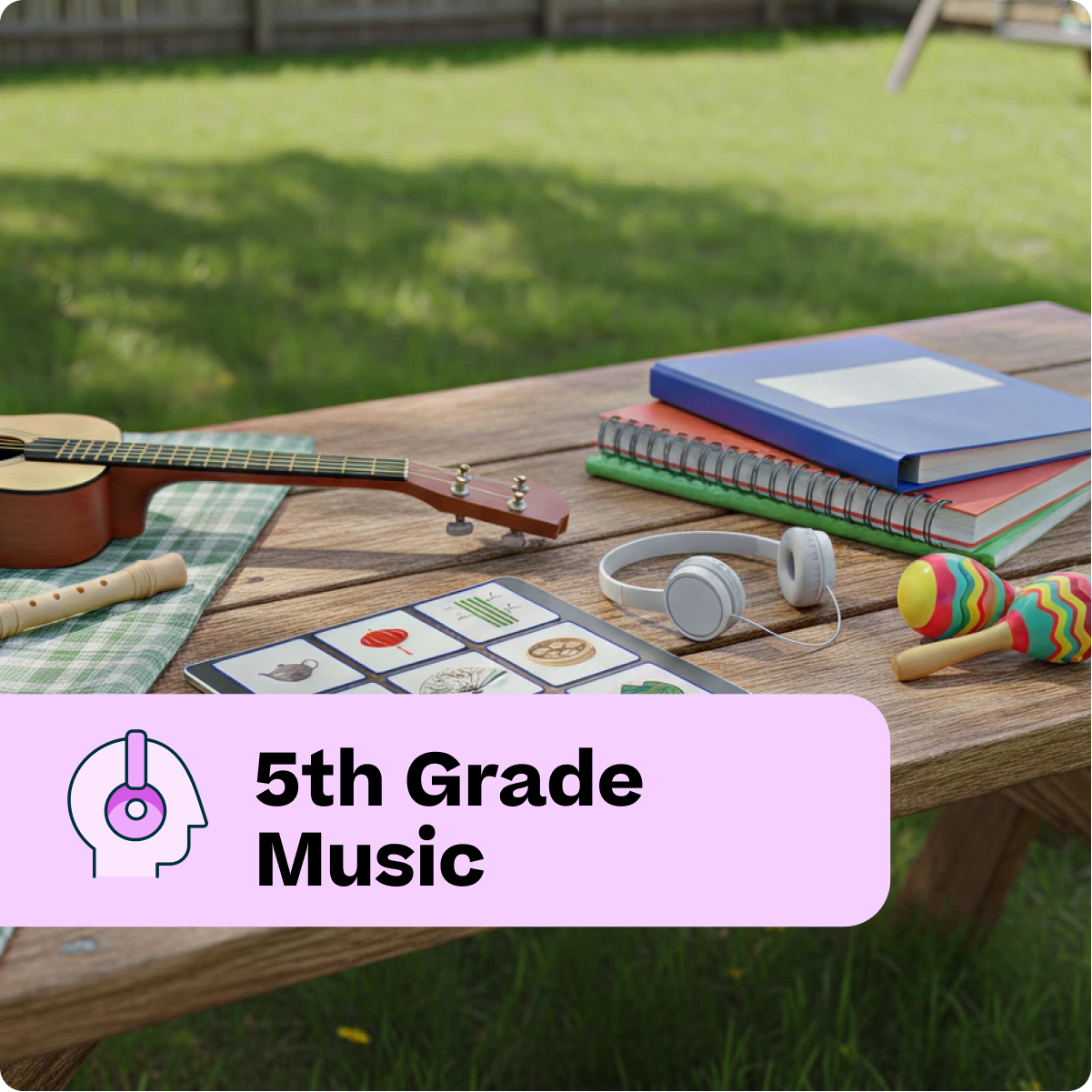 Music-related items on a wooden table outdoors, with a '5th Grade Music' label.