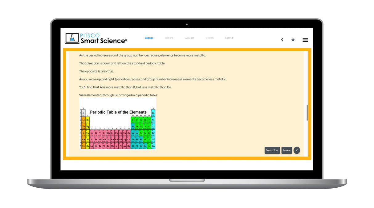 Laptop displaying a science educational website with a periodic table graphic.