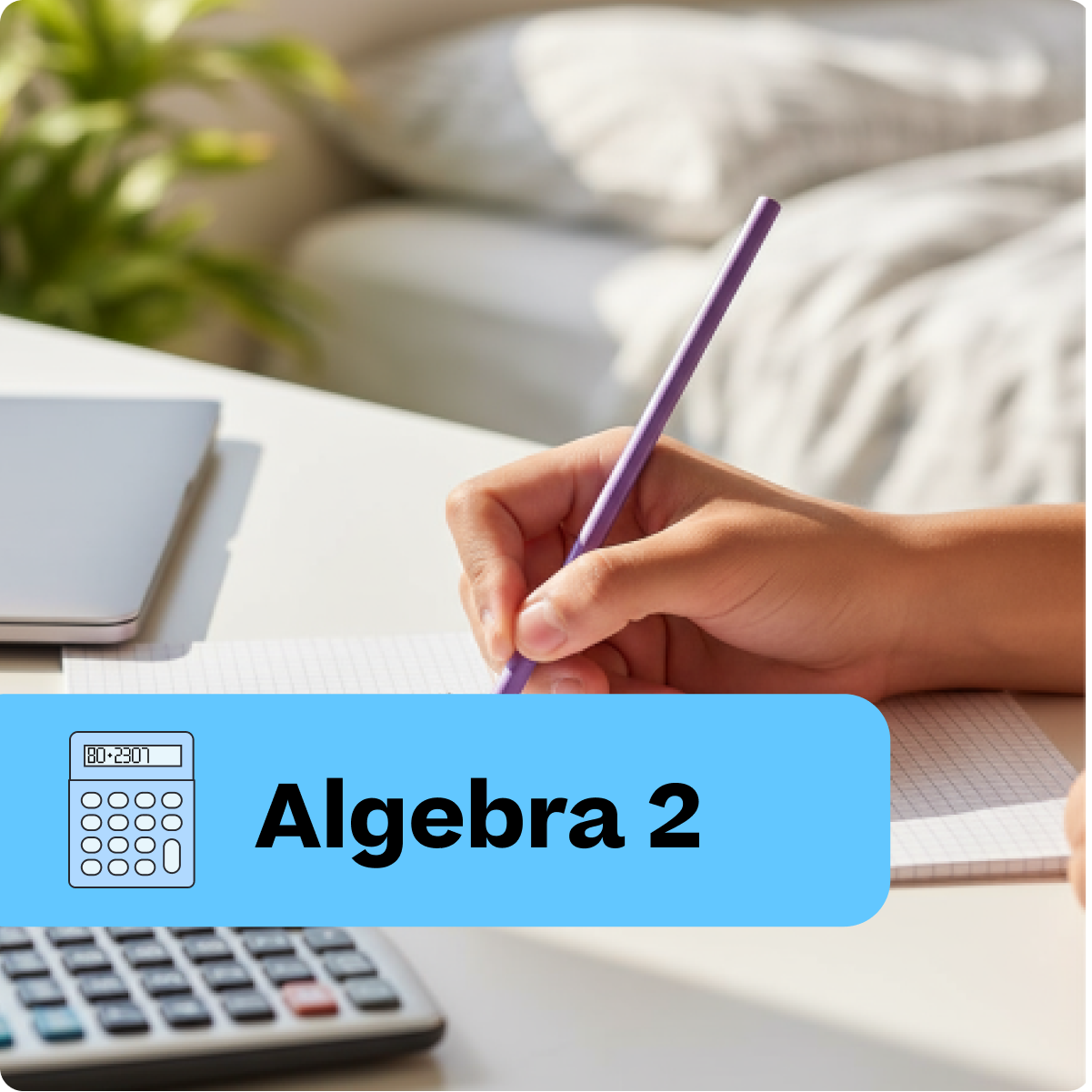 Hand holding a pen with 'Algebra 2' text and calculator on a desk.