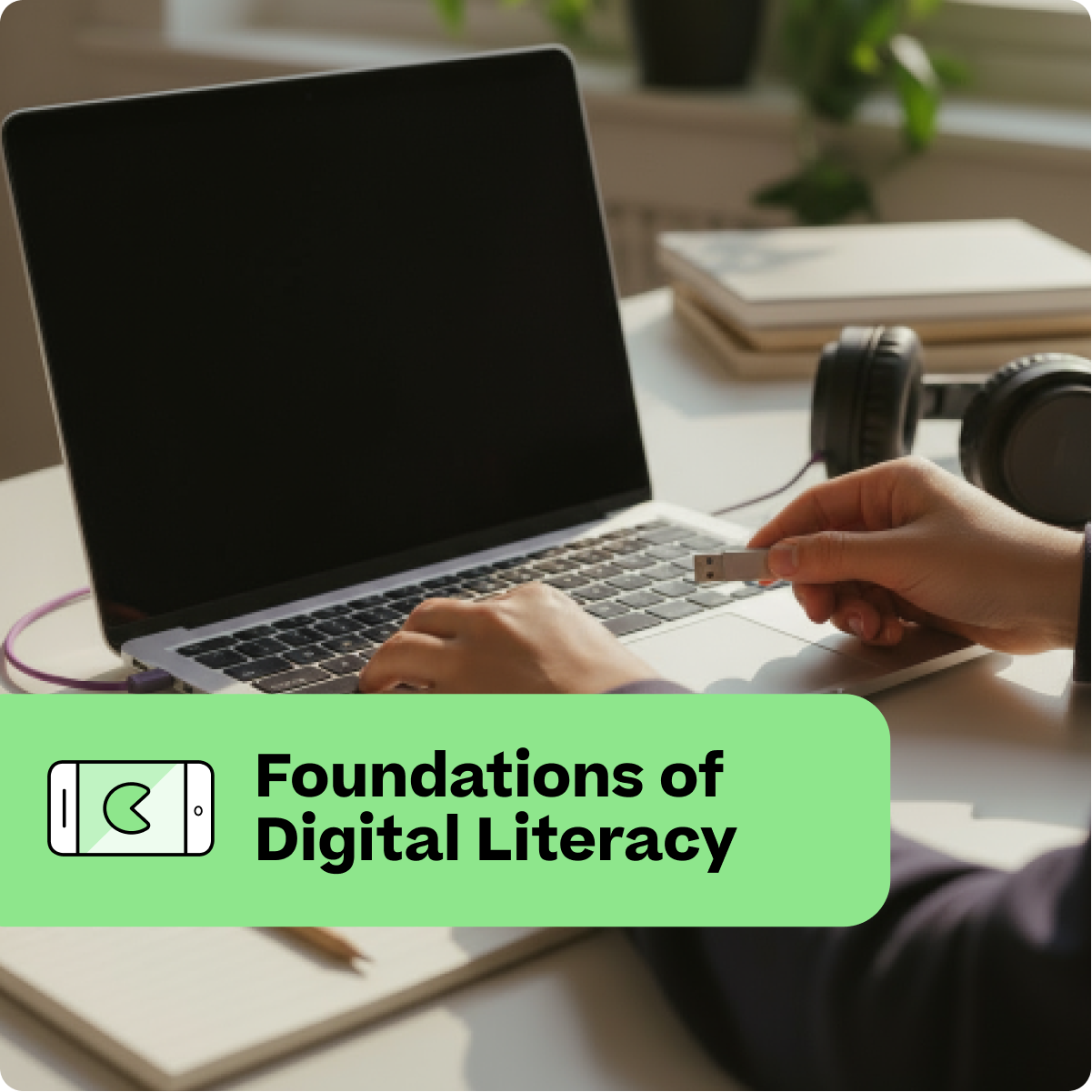 Person using a laptop with a USB drive, with 'Foundations of Digital Literacy' text overlay.