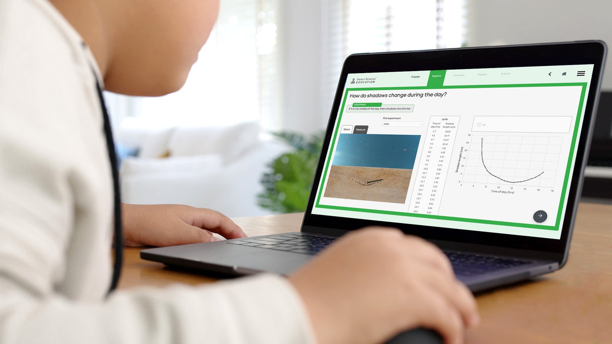 Person using a laptop with a software interface on a desk