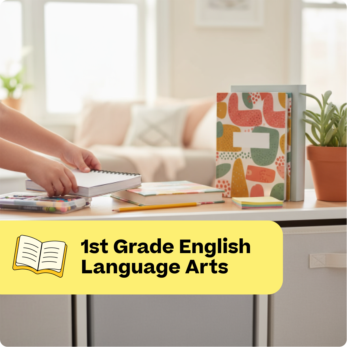 Educational materials on a desk with a yellow label indicating '1st Grade English Language Arts'.