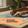 Person using a map with a marker, labeled '2nd Grade Social Studies', on a table.