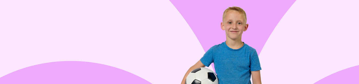 Young boy holding a soccer ball against a pink and purple geometric background