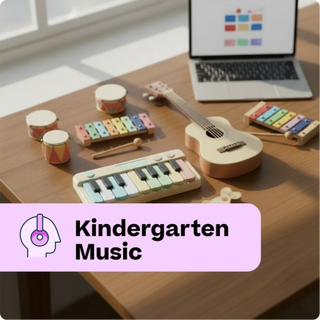 Children's musical toys on a table with a laptop displaying educational content.